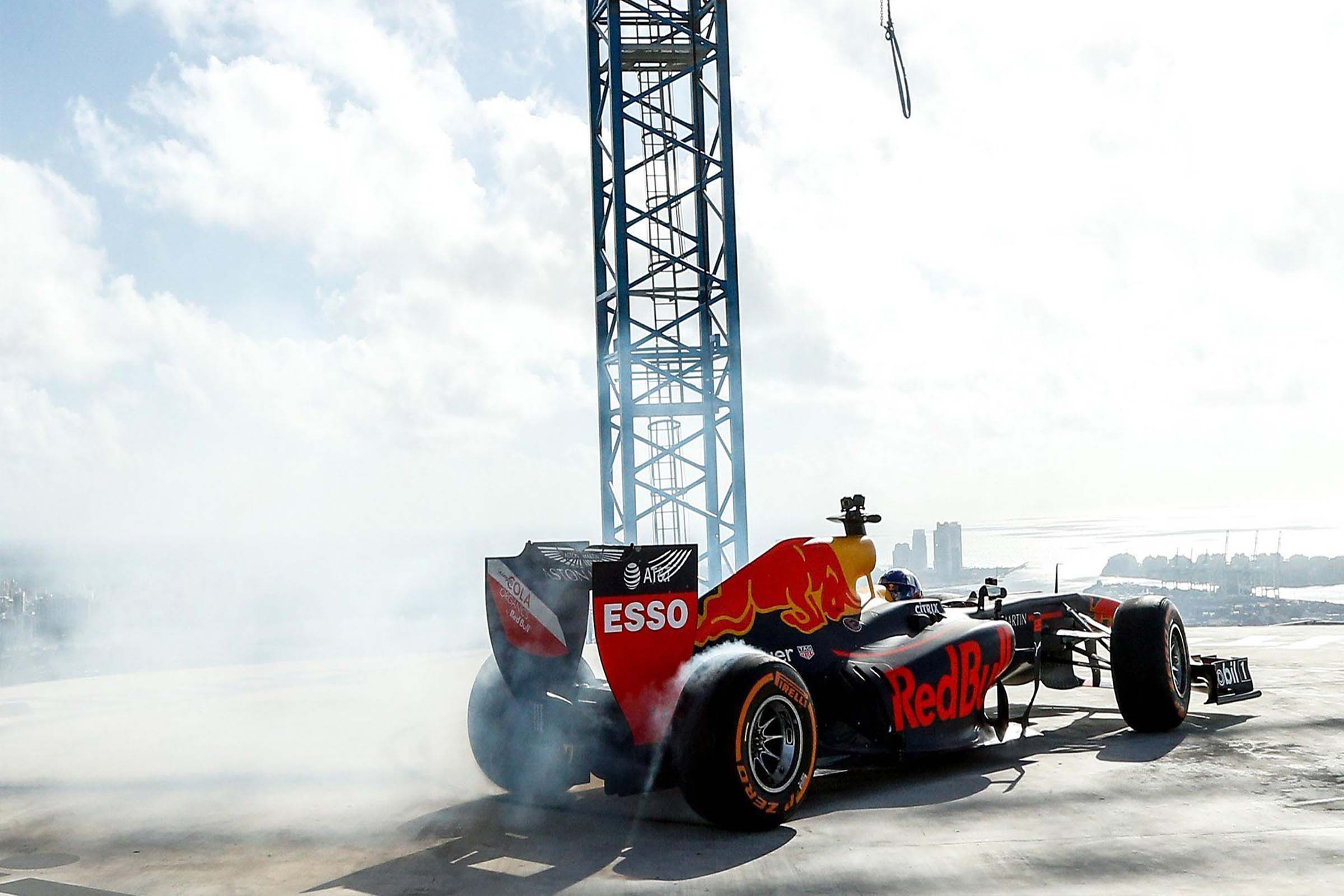 miami race week formula 1 car donuts on high rise rooftop